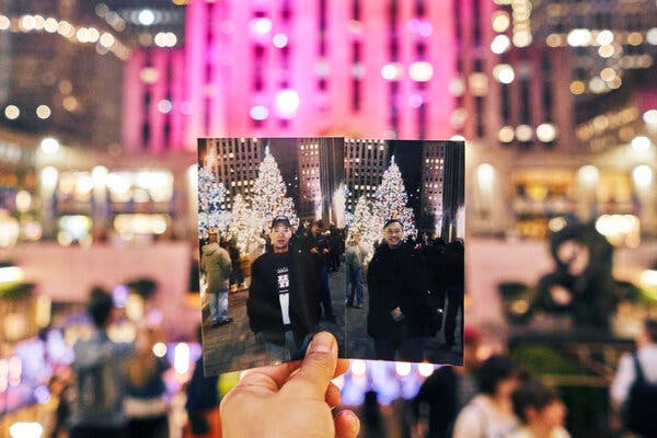 Mr. Lin, left, and Mr. Chin in photographs with the Christmas tree at Rockefeller Center.